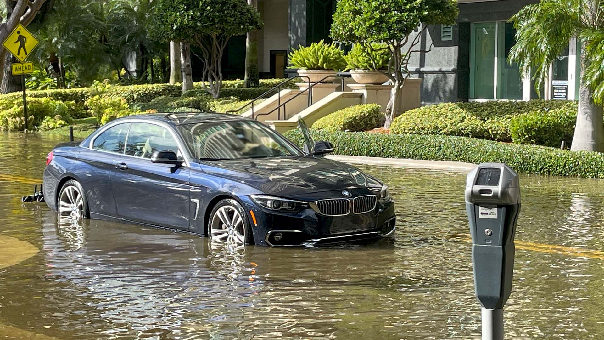 Car stranded in flood water after Hurricane Nicole